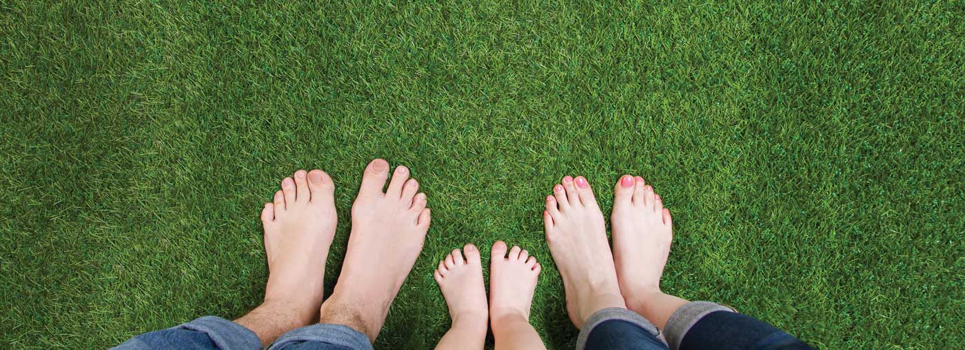 Family standing on septic system